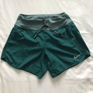 Green Nike running shorts